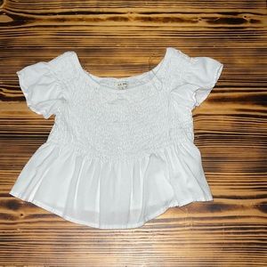 white cropped off the shoulder shirt